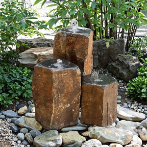 Triple basalt stone column fountains