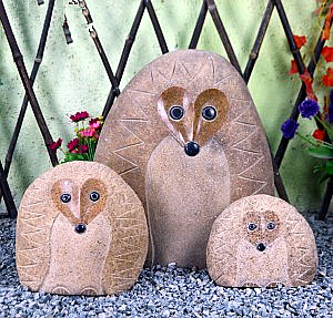 Garden carved stone hedgehog sculptures
