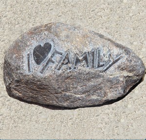 Small heart shape sculpture on rock