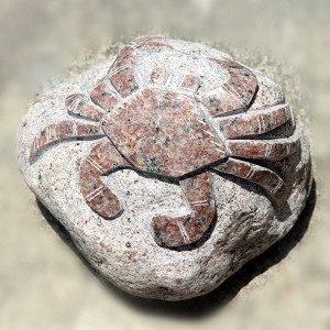 Crab sculpture on rock