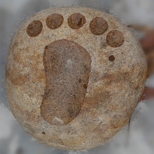 Foot shape sculpture drawing on rock