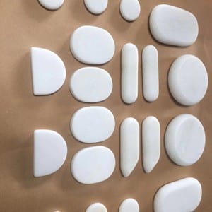 White marble hot facial stones for massage in box