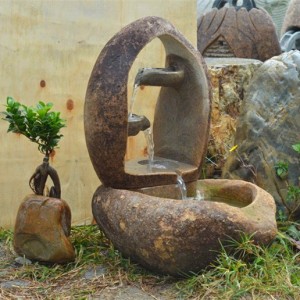 Tiers cobble stone water fountain outdoor
