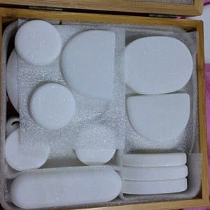 White marble hot facial stones for massage in box