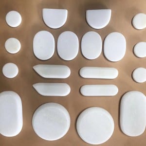 White marble hot facial stones for massage in box