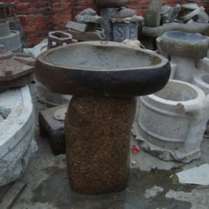 Boulder birdbath on the stand with fish statue