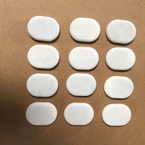 White marble hot facial stones for massage in box