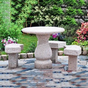 Granite table and curved chairs set outdoor for park