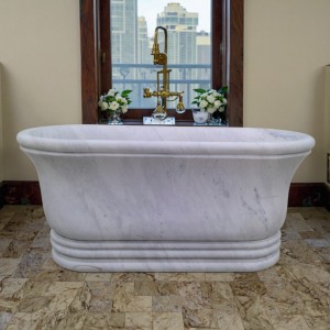 Vintage-Style White Stone Bathtub with Detailed Carved Patterns for Traditional Luxury Bath Spaces