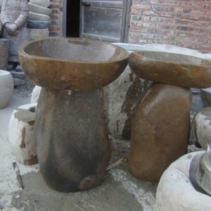 Boulder birdbath on the stand with fish statue