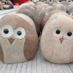 Decorative cobble stone owls statues