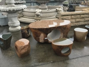 Granite table and curved chairs set outdoor for park