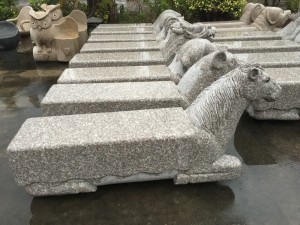 Curved granite bench for garden