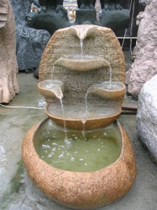 Cobble stone tiered water fountains