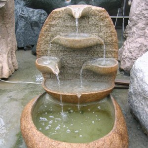 Cobble stone tiered water fountains