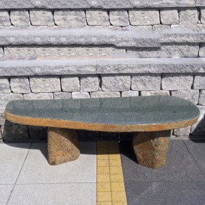 Natural shape basalt stone bench