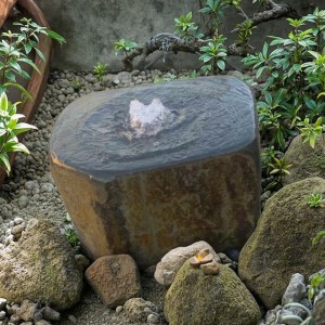 Bold Brown Basalt Column Water Feature Fountain Eye-Catching Garden Statement Piece