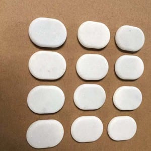 White marble hot facial stones for massage in box