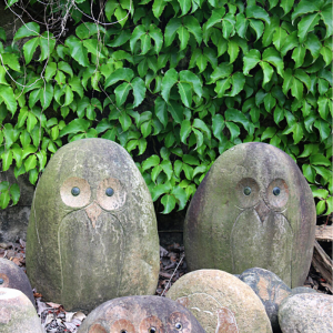 Boulder carved owl statue