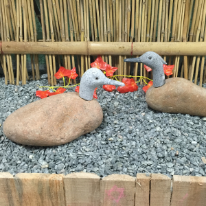 Hand crafted boulder rock duck statue