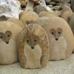 Natural boulder rock hedgehog carving