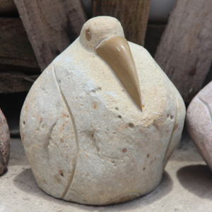 Beige boulder pelican carving for garden decor