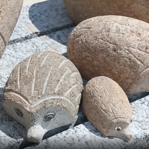 Boulder different size hedgehog carving