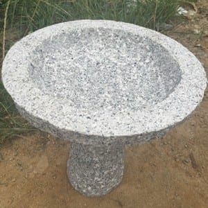 Round granite stone birdbath on stand