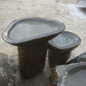 Boulder birdbath on the stand with fish statue