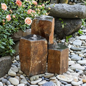 Triple basalt stone column fountains