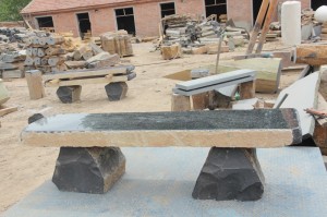 Natural shape basalt stone bench