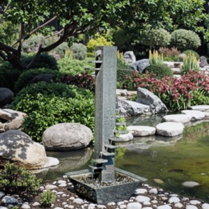 Granite tier stone flow water fountain in garden