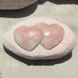 Small heart shape sculpture on rock