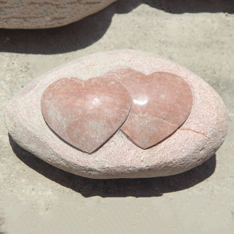 hand carved boulder heart carving