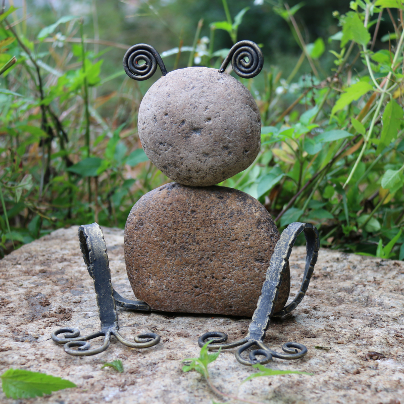 iron frog rock sculpture