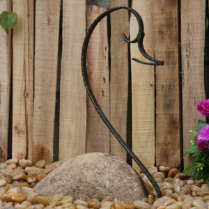 Boulder swan carving with iron