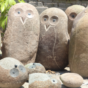 Large boulder owl carving