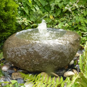 Natural babbling boulder fountain