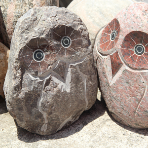 Colored natural boulder owl statue