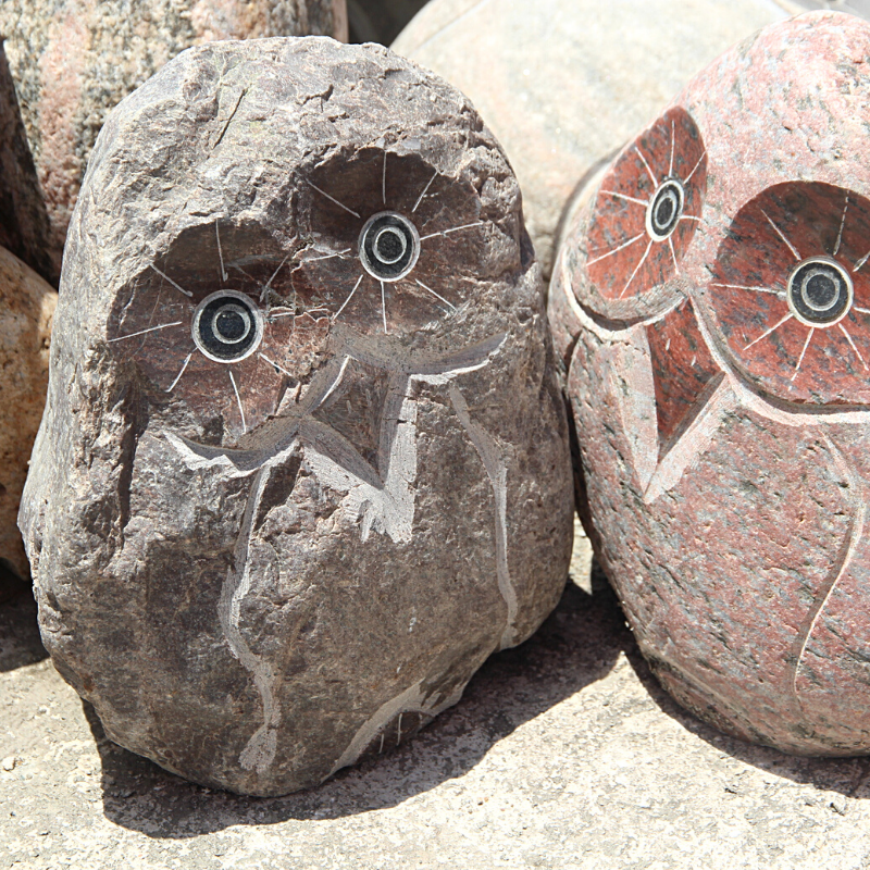 natural boulder owl carving