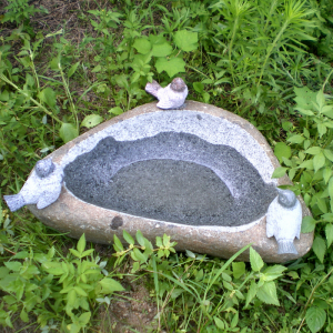 Boulder birdbath with bird statue decor