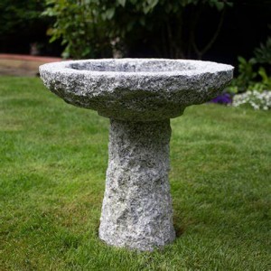 Round granite stone birdbath on stand