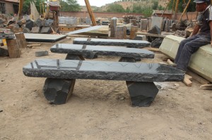 Natural shape basalt stone bench