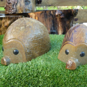 Different-sized rock hedgehog carving