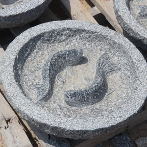 Round granite birdbath with fish