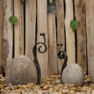 Boulder iron snail carving