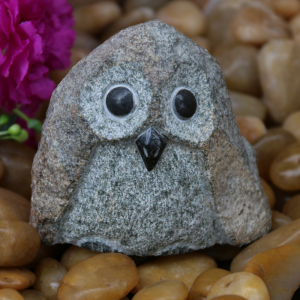 Rock small owl carving