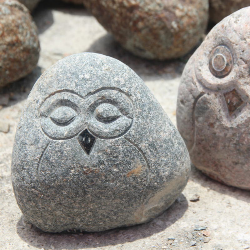 varicolored natural stone owl statue
